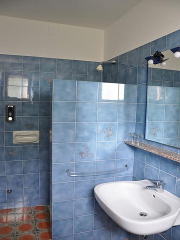 Hotel L'Oasi Кала Гононе Стая снимка