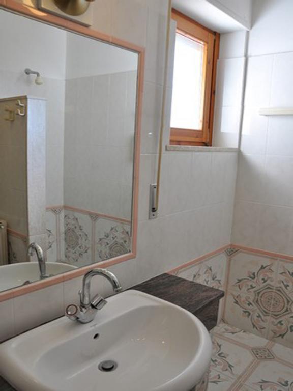 Hotel L'Oasi Кала Гононе Стая снимка